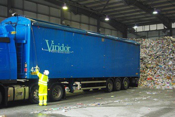 A lorry unloads material at Viridor's MRF in Ford, West Sussex